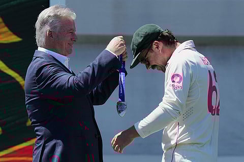 Australia's Travis Head, right, receives the man-of-the-match medal from Steve Waugh following play on the last day of the fifth and final Ashes cricket test between England and Australia in Sydney.