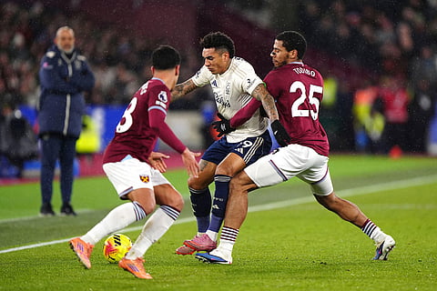 Nottingham Forest's Igor Jesus battles for the ball against West Ham United's Mateus Fernandes, left, and Jean-Clair Todibo during the English Premier League soccer match between West Ham United and Nottingham Forest in London.