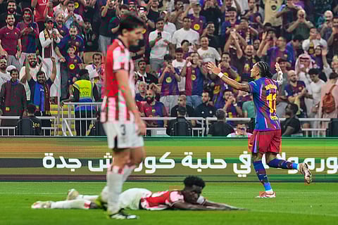 Barcelona's Raphinha celebrates after scoring the fifth goal during the Spanish Super Cup semifinal soccer match against Athletic Club Bilbao at King Abdullah Sports City Stadium in Jeddah, Saudi Arabia.