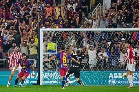 Barcelona's Ferran Torres, second left, celebrates after scoring the opening goal during the Spanish Super Cup semifinal soccer match against Athletic Club Bilbao at King Abdullah Sports City Stadium in Jeddah, Saudi Arabia.