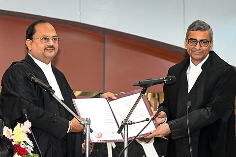 Chief Justice of Patna High Court Justice Sangam Kumar Sahoo, left, administers oath to advocate Justice Ritesh Kumar as Judge of Patna High Court at Centenary Hall, in Patna.