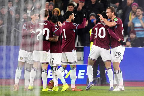 West Ham United's Taty Castellanos, center, and teammates celebrate and own goal by Nottingham Forest's Murillo during the English Premier League soccer match between West Ham United and Nottingham Forest in London.