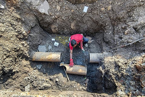 A civic worker during restoration work of Narmada water pipelines in the aftermath of deaths caused by consumption of allegedly contaminated water, in the Bhagirathpura area of Indore, Madhya Pradesh.