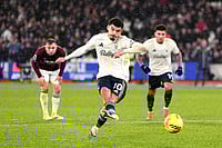 | Photo: John Walton/PA via AP : Nottingham Forest's Morgan Gibbs-White scores his side's second goal during the English Premier League soccer match between West Ham United and Nottingham Forest in London.