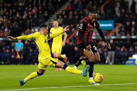 Tottenham Hotspur's Pedro Porro, left, challenges Bournemouth's Antoine Semenyo during the English Premier League soccer match between Bournemouth and Tottenham Hotspur in Bournemouth, England.