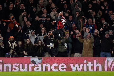 Bournemouth's Eli Junior Kroupi celebrates scoring their side's second goal of the game during the English Premier League soccer match between Bournemouth and Tottenham Hotspur in Bournemouth, England.