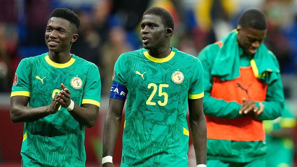 Senegal players walk off the pitch after the Africa Cup of Nations round of 16 match against Sudan in Tangier. - AP