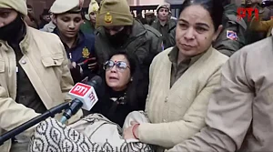 Source: X / PTI : Video screengrab of police detaining TMC MP Mahua Moitra as party MPs protest outside Union Home Minister Amit Shah's office against ED raids on the I-PAC office in Kolkata