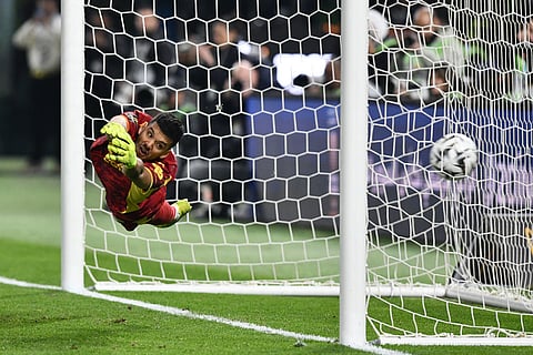 Marseille's goalkeeper Geronimo Rulli fails to make a save during a penalty shootout at the end of the French Super Cup soccer match between PSG and Marseille in Kuwait City, Kuwait.