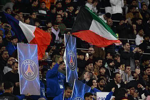 PSG supporters fill the stands for the French Super Cup soccer match between PSG and Marseille in Kuwait City, Kuwait.