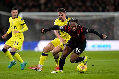 Bournemouth's Antoine Semenyo, right, and Tottenham Hotspur's Joao Palhinha battle for the ball during the English Premier League soccer match between Bournemouth and Tottenham Hotspur in Bournemouth, England.