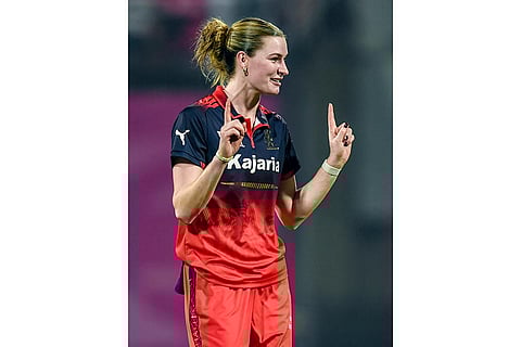 Royal Challengers Bengaluru’s Lauren Bell celebrates the wicket of Mumbai Indians' Amelia Kerr during a Women's Premier League (WPL) T20 cricket match between Mumbai Indians and Royal Challengers Bengaluru, at the DY Patil Stadium, in Navi Mumbai.