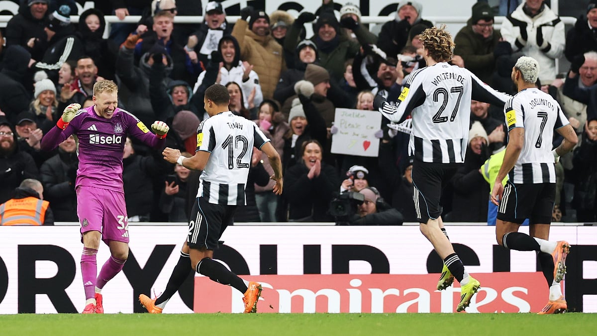 Aaron Ramsdale celebrates his penalty shoot-out heroics with his Newcastle team-mates - null
