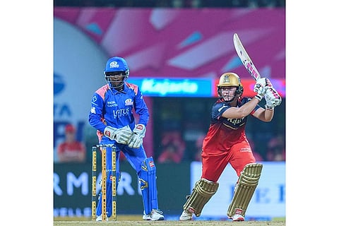 Royal Challengers Bengaluru’s Nadine de Klerk plays a shot during a Women's Premier League (WPL) T20 cricket match between Mumbai Indians and Royal Challengers Bengaluru, at the DY Patil Stadium, in Navi Mumbai.