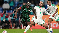 | Photo: AP/Themba Hadebe : Nigeria's Victor Osimhen, left, and Algeria's Himad Abdelli challenge for the ball during the Africa Cup of Nations quarterfinal soccer match between Nigeria and Algeria, in Marrakech, Morocco, Saturday, Jan. 10, 2026. 