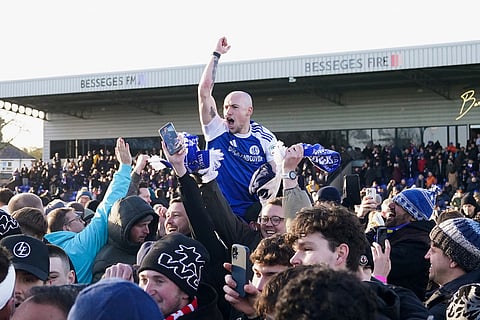 Macclesfield Town's Josh Kay celebrates with fans following the FA Cup third round soccer match between Macclesfield Town and Crystal Palace, at the Leasing.com Stadium, Macclesfield, England.