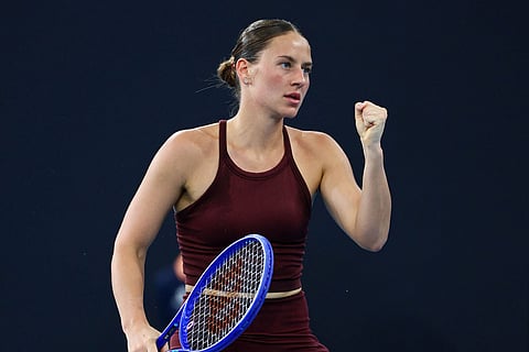 Marta Kostyuk of Ukraine reacts after winning a point during the women's final match against Aryna Sabalenka of Belarus at the Brisbane International tennis tournament in Brisbane, Australia.