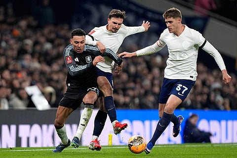 Aston Villa's Morgan Rogers, left, battles with Tottenham Hotspur's Joao Palhinha, centre, and Micky van de Ven during the FA Cup third round soccer match between Tottenham Hotspur and Aston Villa in London.