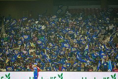 Fans cheer in the stands during a Women's Premier League (WPL) T20 cricket match between Mumbai Indians and Delhi Capitals, at the DY Patil Stadium, in Navi Mumbai.
