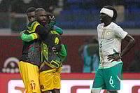 | Photo: AP/Themba Hadebe : Senegal's Pathe Ciss, right, and Mali players react after the Africa Cup of Nations quarterfinal soccer match between Senegal and Mali in Tangier, Morocco