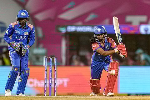 Delhi Capitals' Niki Prasad plays a shot during a Women's Premier League (WPL) T20 cricket match between Mumbai Indians and Delhi Capitals, at the DY Patil Stadium, in Navi Mumbai.