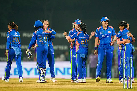 Navi Mumbai: Mumbai Indians' players celebrate after winning the Women's Premier League (WPL) T20 cricket match between Mumbai Indians and Delhi Capitals, at the DY Patil Stadium, in Navi Mumbai.