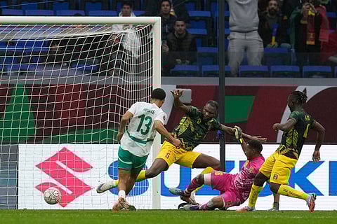 Senegal's Iliman Ndiaye scores the opening goal of his team during the Africa Cup of Nations quarterfinal soccer match between Senegal and Mali in Tangier, Morocco.