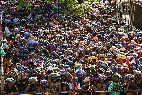 Ayyappa devotees gather at Sabarimala Sannidhanam to offer prayers ahead of the Makaravilakku festival, in Pathanamthitta, Kerala.