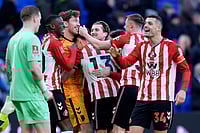 | Photo: Peter Byrne/PA via AP : Sunderland goalkeeper Robin Roefs is congratulated by team-mates following the penalty shoot-out after the Emirates FA Cup third round match between Everton and Sunderland in Liverpool, England.
