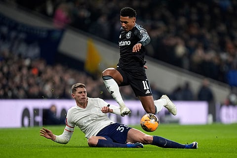 Tottenham Hotspur's Micky van de Ven, left, challenges Aston Villa's Ollie Watkins during the FA Cup third round soccer match between Tottenham Hotspur and Aston Villa in London.