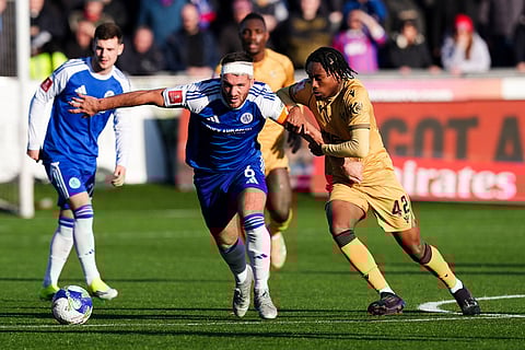 Crystal Palace's Kaden Rodney, center right, and Macclesfield Town's Paul Dawson vie for the ball, during the FA Cup third round soccer match between Macclesfield Town and Crystal Palace, at the Leasing.com Stadium, Macclesfield,  Saturday, Jan. 10, 2026. ()
