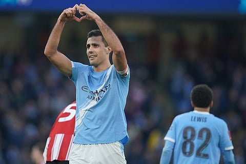 Manchester City's Rodrigo celebrates after scoring during the FA Cup third round match between Manchetster City and Exeter in Manchester, England.