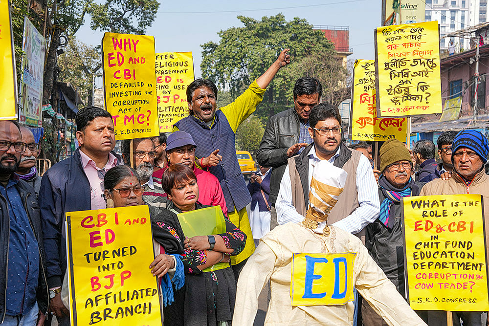 Kolkata: Congress activists hold placards during a protest against the Central and State governments over the alleged misuse of central agencies, in Kolkata. - | Photo: PTI/Swapan Mahapatra