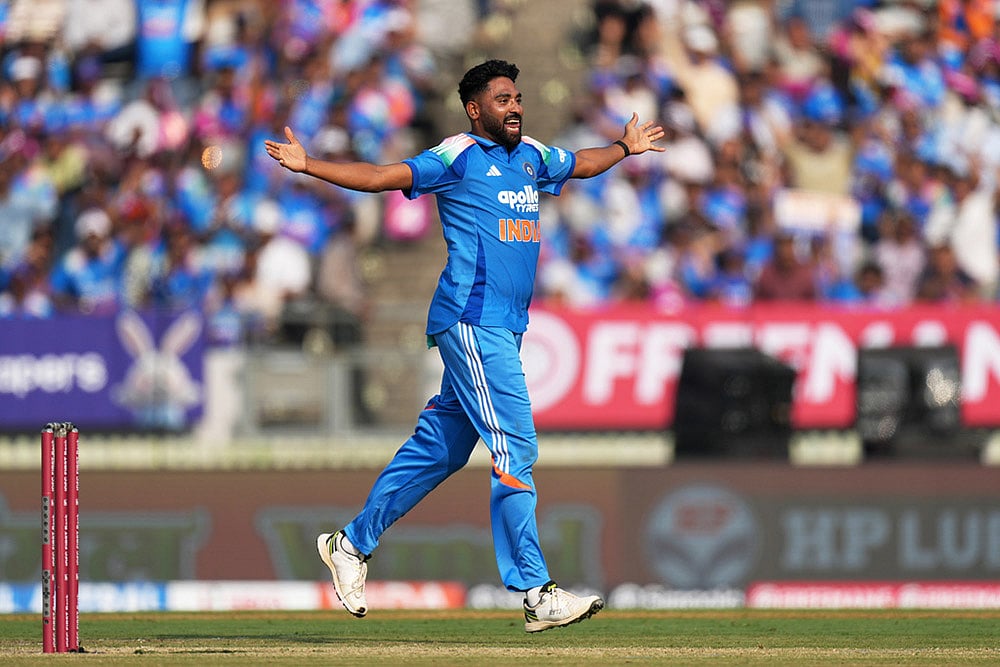 Indias Mohammed Siraj celebrates the wicket of New Zealands Will Young