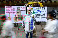 | Photo: PTI : A student of the Gurukul School of Art wears an Electronic Voting Machine (EVM)-themed costume made of paper as part of a voter’s awareness campaign ahead of the Brihanmumbai Municipal Corporation (BMC) election, in Mumbai.