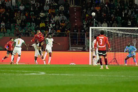 Egypt's Ramy Rabiaa, fourth from left, scores his side's second goal during the Africa Cup of Nations quarterfinal soccer match between Egypt and Ivory Coast, in Agadir, Morocco.