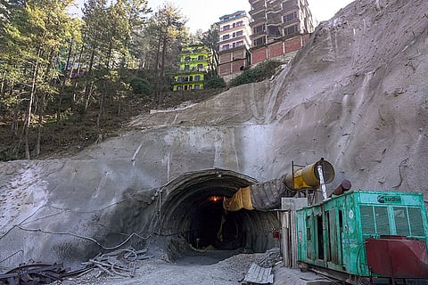 A view of an under-construction tunnel that causes damage and cracks to surrounding buildings at the Chalaunthi area, in Shimla.