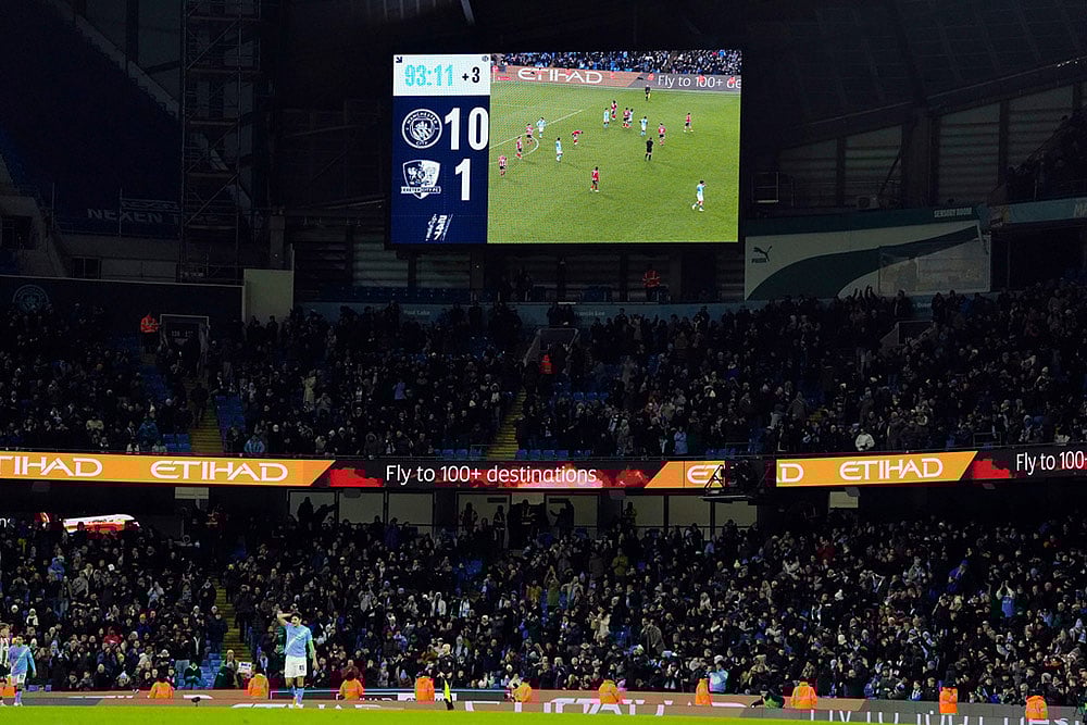 The scoreboard displays the 10-1 scoreline during the FA Cup third round match between Manchester City and Exeter in Manchester, England. - | Photo: Nick Potts/PA via AP