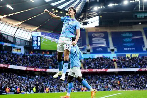 Manchester City's Max Alleyne celebrates scoring the opening goal during the FA Cup third round match between Manchester City and Exeter in Manchester, England.