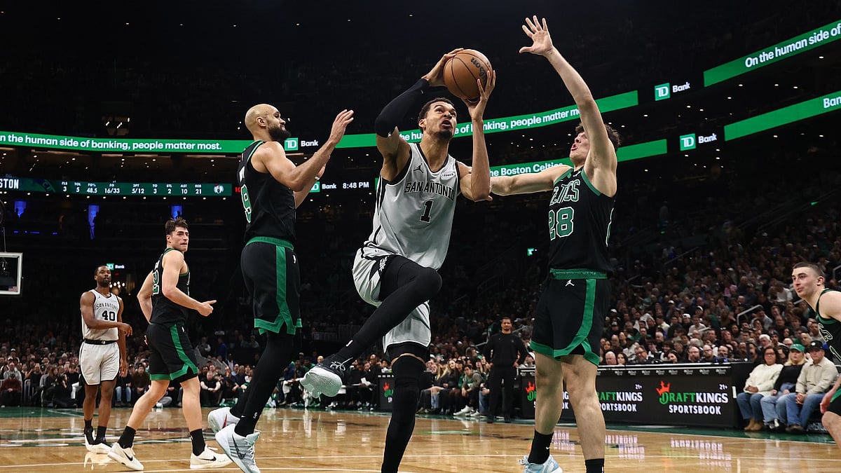 Victor Wembanyama #1 of the San Antonio Spurs drives on Hugo Gonzalez #28 of the Boston Celtics during the second quarter at TD Garden on January 10, 2026 in Boston, Massachusetts. - null