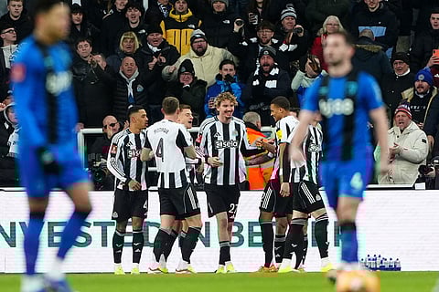 Newcastle United's Harvey Barnes, third left, celebrates with team-mates after scoring their side's first goal of the game during the FA Cup third round soccer match between Newcastle United and Bournemouth in Newcastle, England.