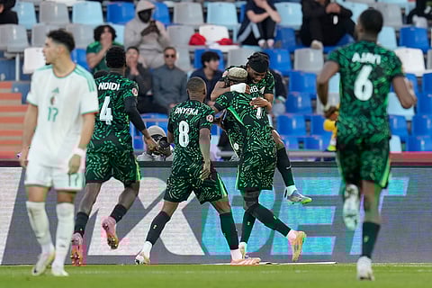 Nigeria's Victor Osimhen celebrates with teammates after scoring the opening goal during the Africa Cup of Nations quarterfinal soccer match between Nigeria and Algeria, in Marrakech, Morocco.