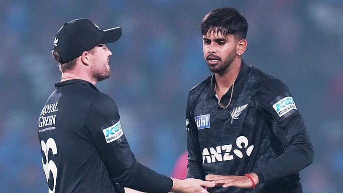 New Zealand's Adithya Ashok, right, celebrates with teammate Henry Nicholls the wicket of India's captain Shubman Gill during the first ODI in Vadodara. - AP