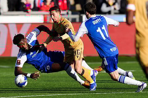 Crystal Palace's Yeremi Pino and Macclesfield Town's Rollin Menayese vie for the ball, during the FA Cup third round soccer match between Macclesfield Town and Crystal Palace, at the Leasing.com Stadium, Macclesfield, England.