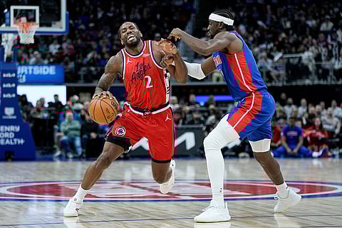 Los Angeles Clippers forward Kawhi Leonard, left, drives against Detroit Pistons guard Caris LeVert, right, during the second half of an NBA basketball game  in Detroit.