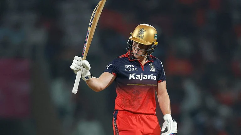 Grace Harris celebrates her half-century during the Women's Premier League 2026 match between Royal Challengers Bengaluru and UP Warriorz. - WPL