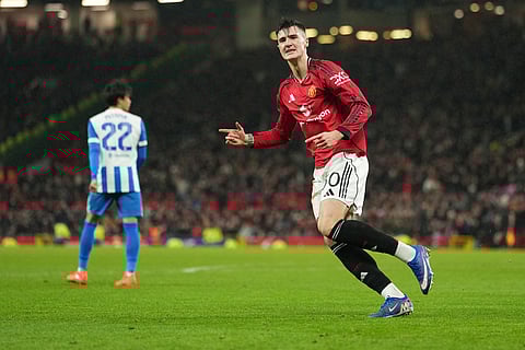 Manchester United's Benjamin Sesko celebrates after scoring during the FA Cup third round soccer match between Manchester United and Brighton in Manchester, England.