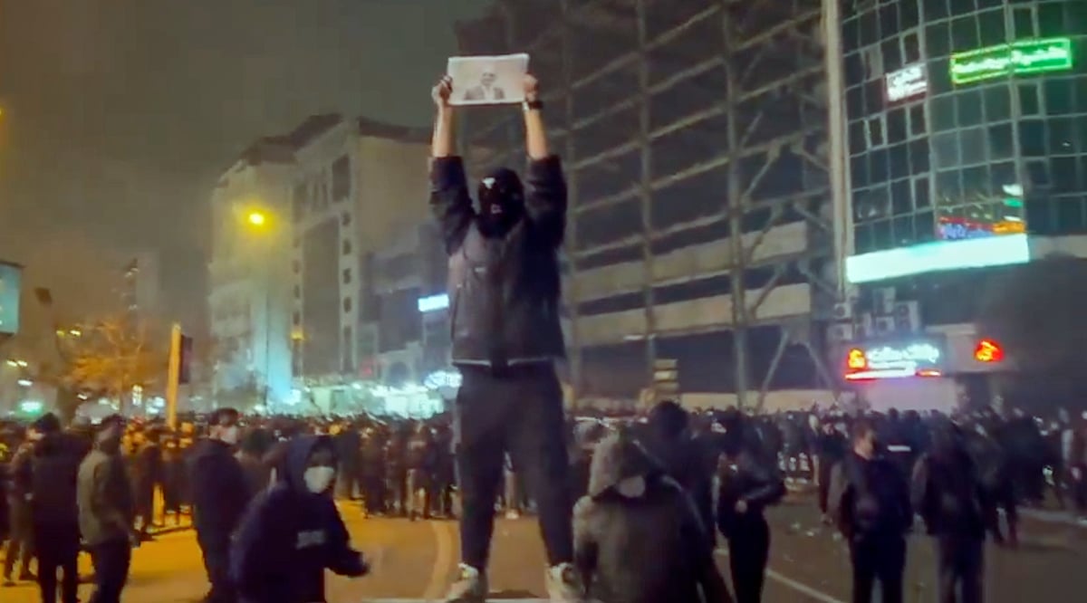 In this frame grab from footage circulating on social media shows protesters dancing and cheering around a bonfire as they take to the streets despite an intensifying crackdown as the Islamic Republic remains cut off from the rest of the world, in Tehran, Iran, Friday, Jan. 9, 2026. - (UGC via AP)