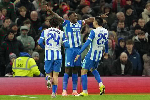 Brighton's Danny Welbeck celebrates after scoring during the FA Cup third round soccer match between Manchester United and Brighton in Manchester, England.