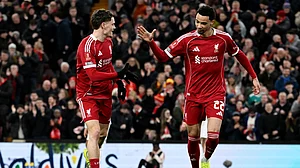 Liverpool's goalscorer Florian Wirtz celebrates with Hugo Ekitike.